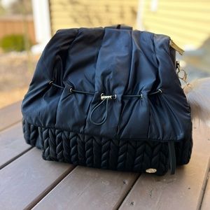 Happ Brand designer diaper bag. Includes changing pad, strap, and duster bag